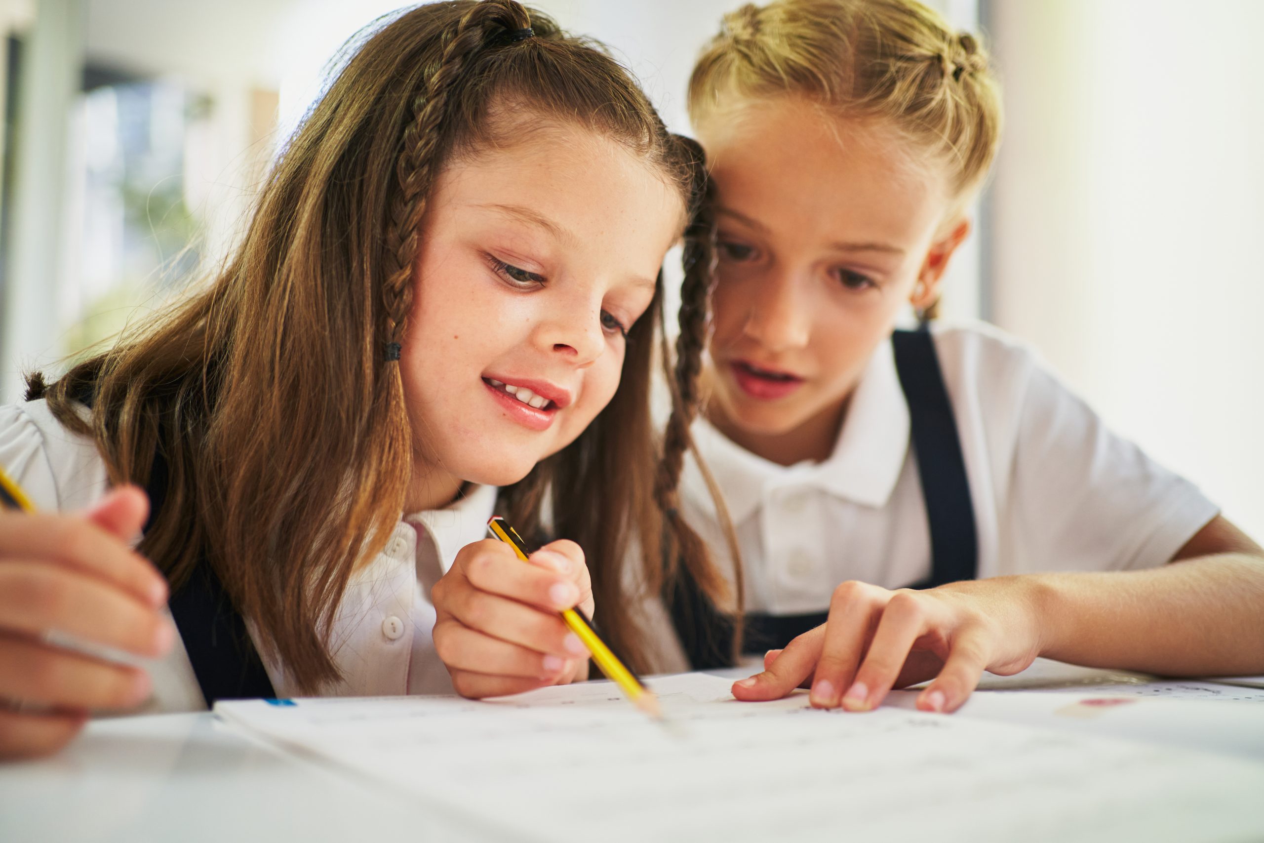 Two,School,Girls,Cooperating,And,Helping,Each,Other,To,Finish