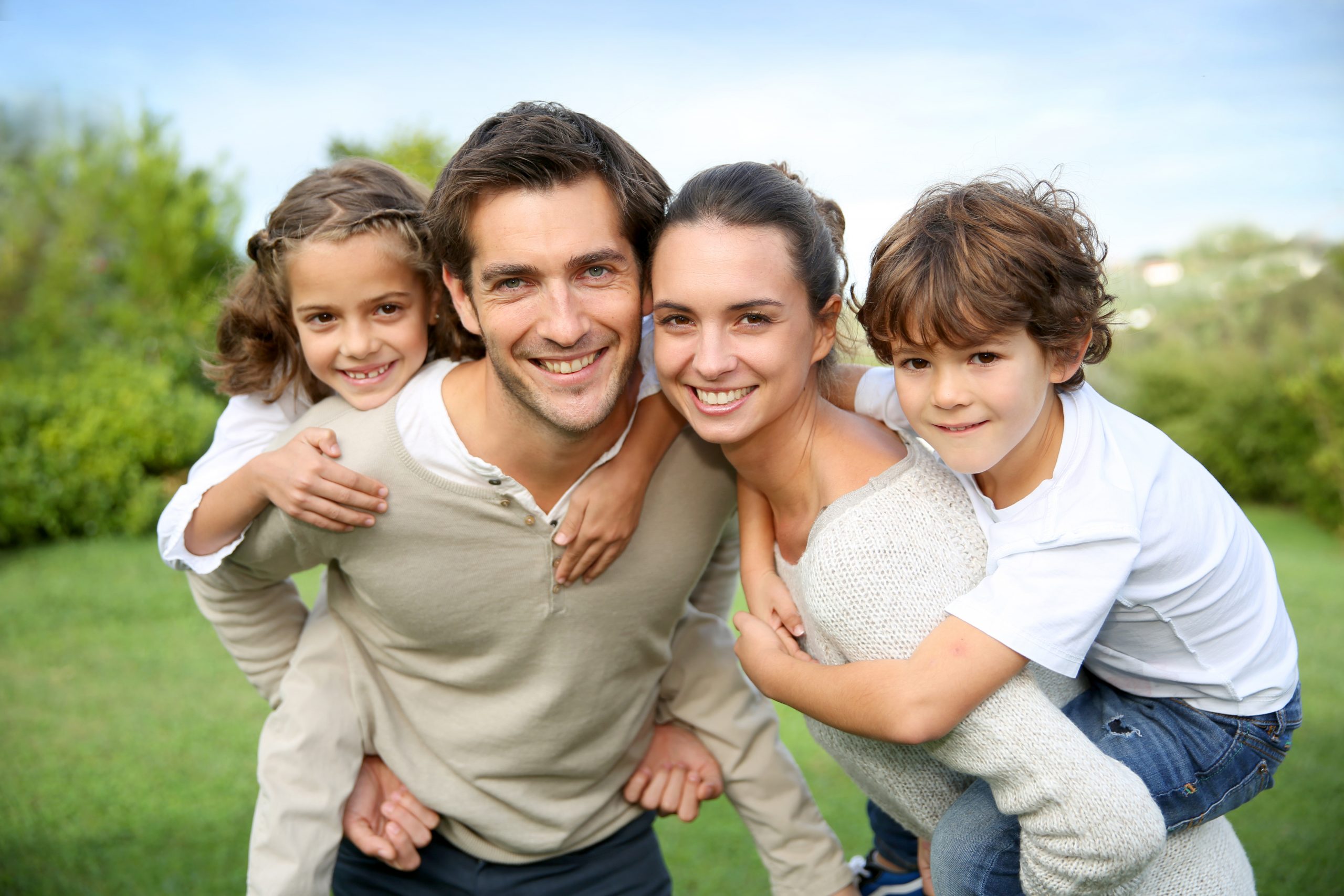 Parents,Giving,Piggyback,Ride,To,Children