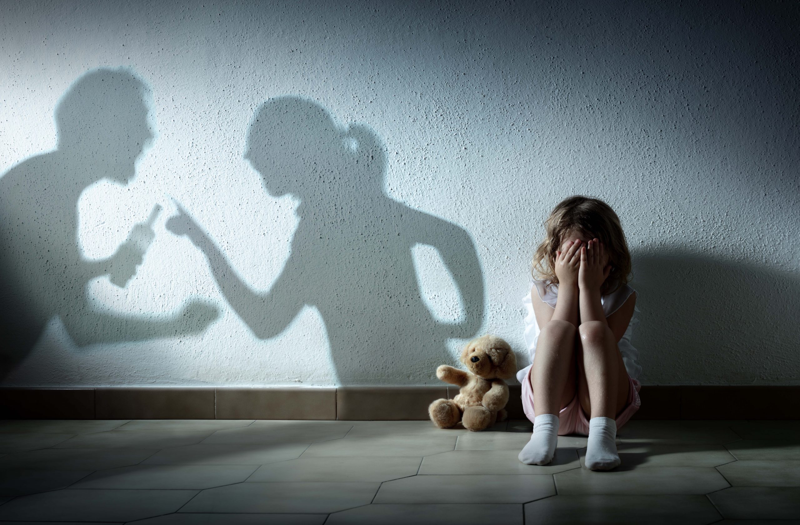 Little,Girl,Crying,With,Shadow,Of,Parents,Arguing,-,Home