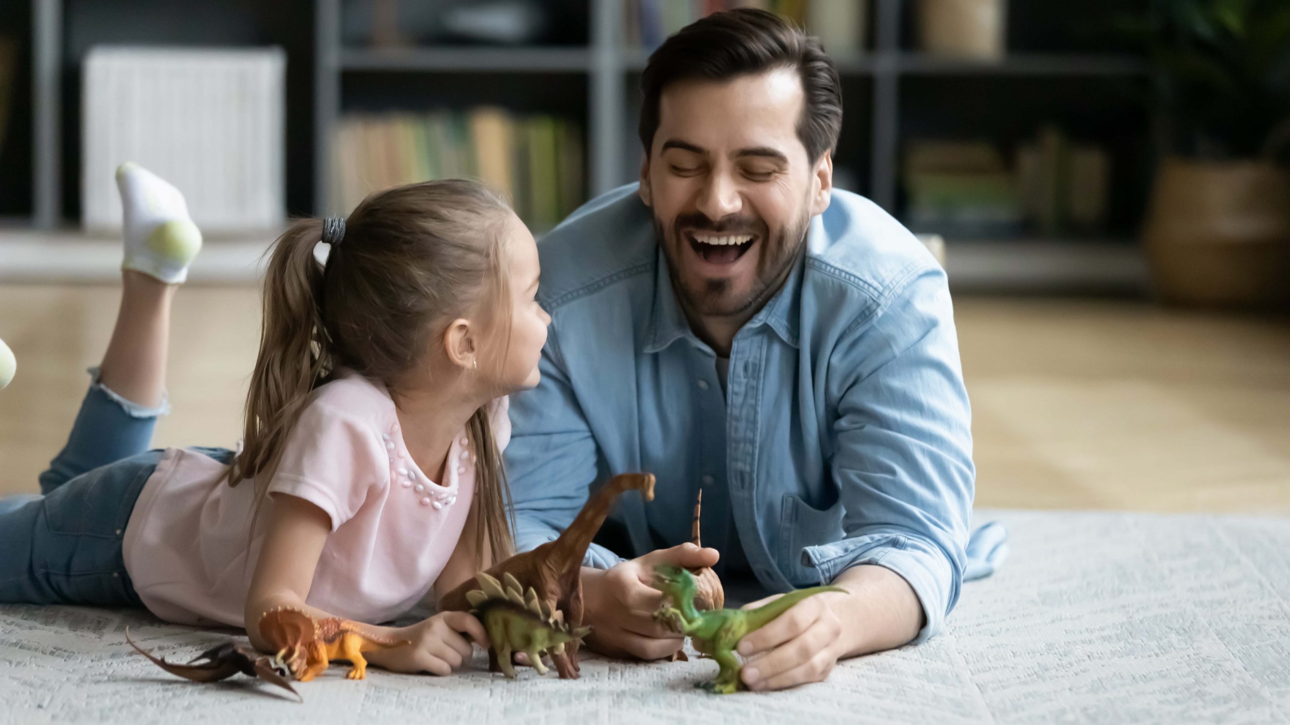 Father,Lying,On,Warm,Floor,On,Carpet,Laughing,Having,Fun
